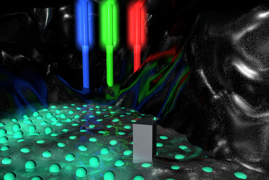 A 3D render showing three glowing vertical beams—blue, green, red—illuminating a textured surface dotted with cyan spheres and a central gray block
