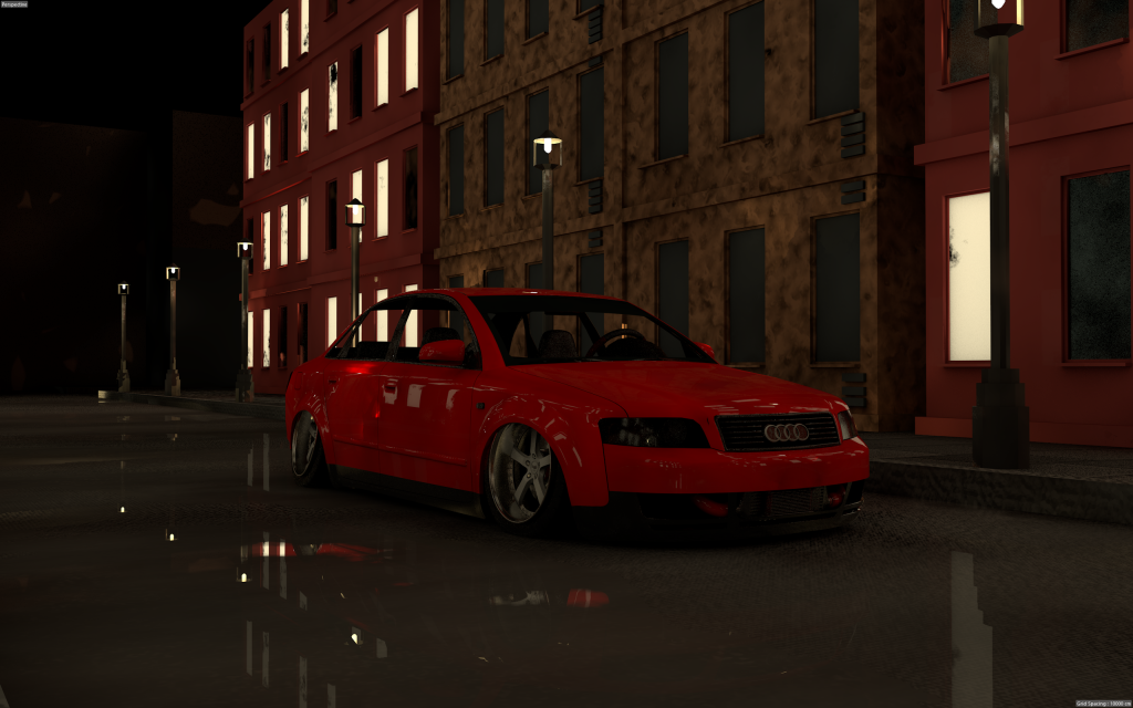 A red Audi sedan parked on a wet city street at night, flanked by illuminated buildings and streetlights reflecting on the pavement